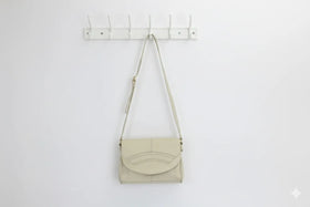 Cream faux leather sling bag