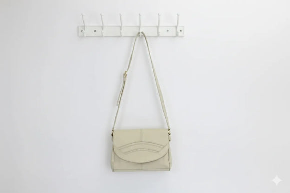Cream faux leather sling bag