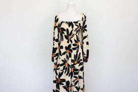 Cream long-sleeved A-line maxi dress with black/orange print - M