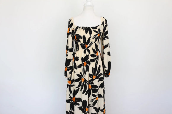 Cream long-sleeved A-line maxi dress with black/orange print - M