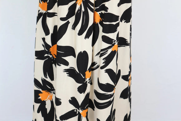 Cream long-sleeved A-line maxi dress with black/orange print - M