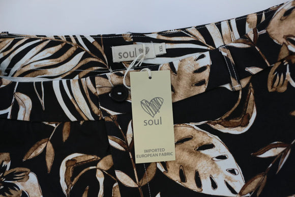 Black pants with beige leaf